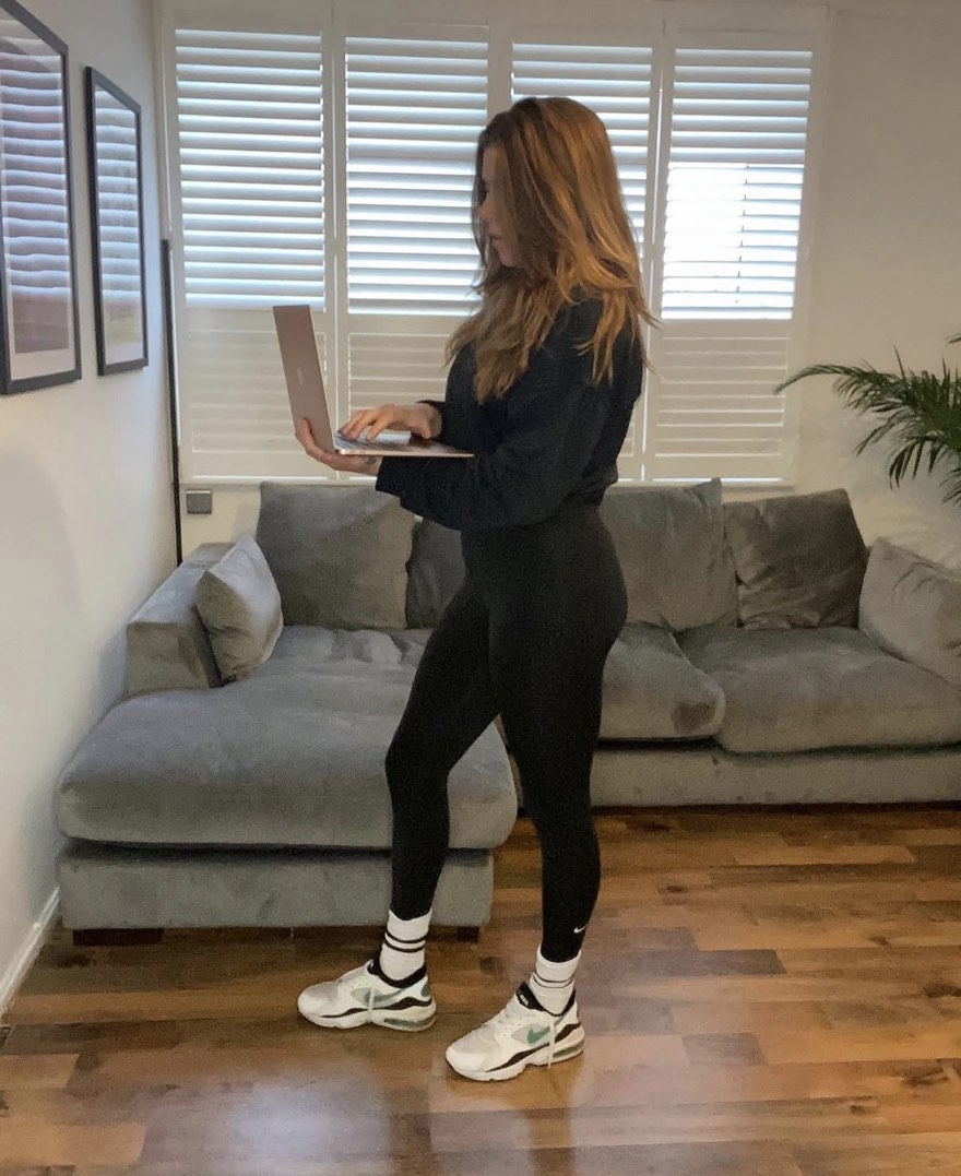 Louise coaching online with a laptop at home