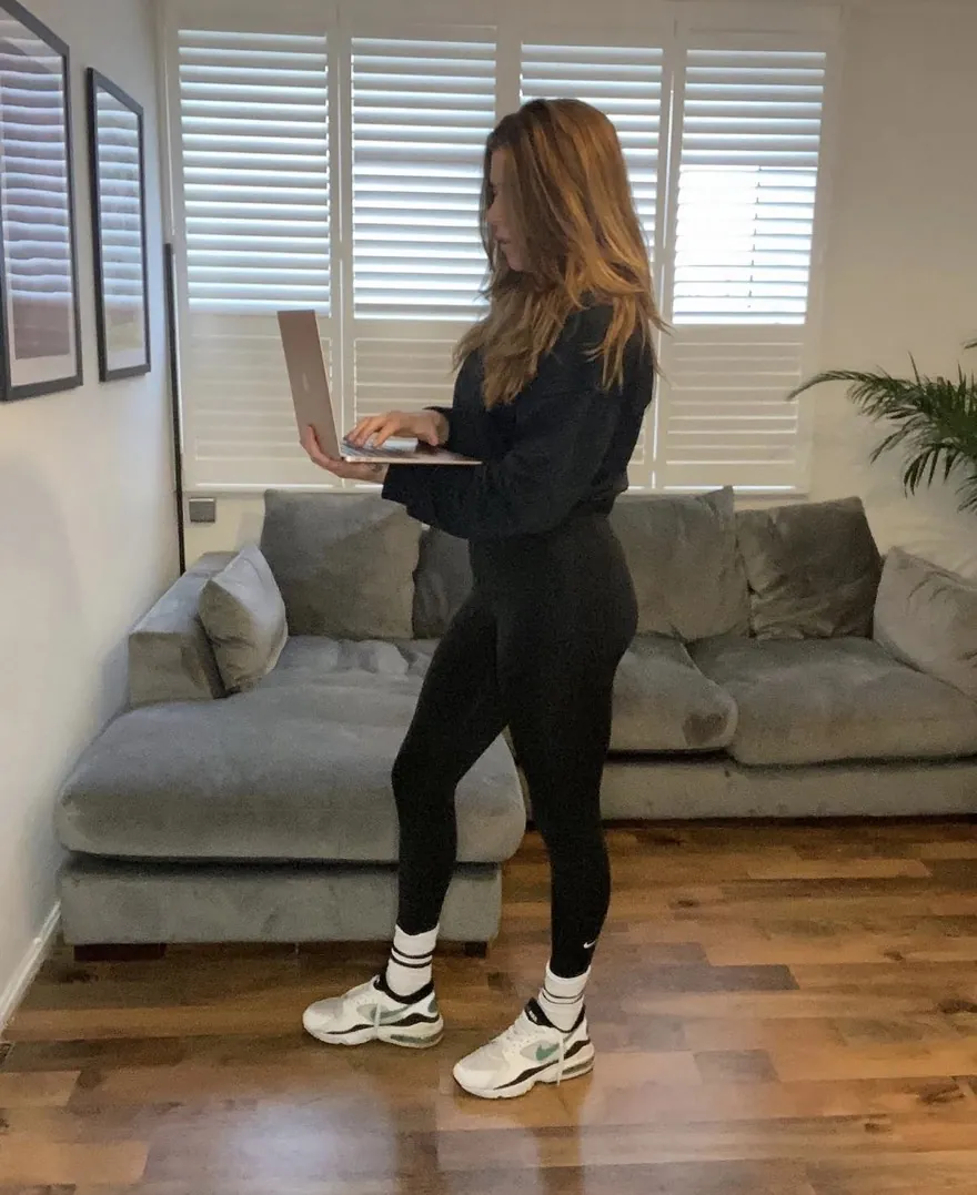 Louise coaching online with a laptop at home